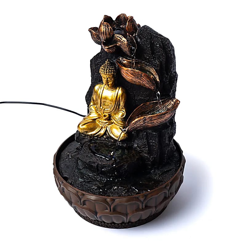 Meditating buddha with lotus water fountain