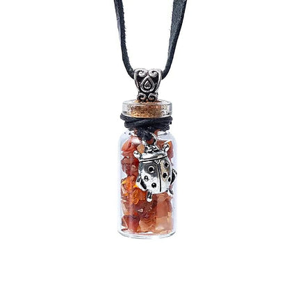 Fiole cadeau en verre sur corde cornaline et coccinelle thumb